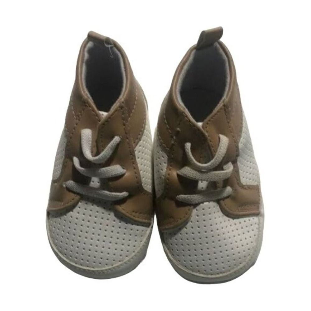 Child of mine made by carters brown and white soft bottom shoes size 3/6M